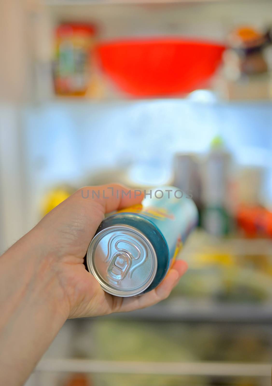 Man taking beer from fridge by mady70