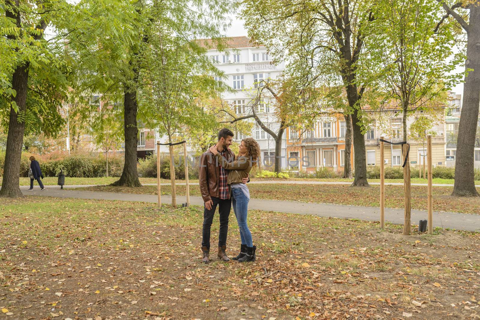 Young couple enjoying the time in the city park by VeraAgency