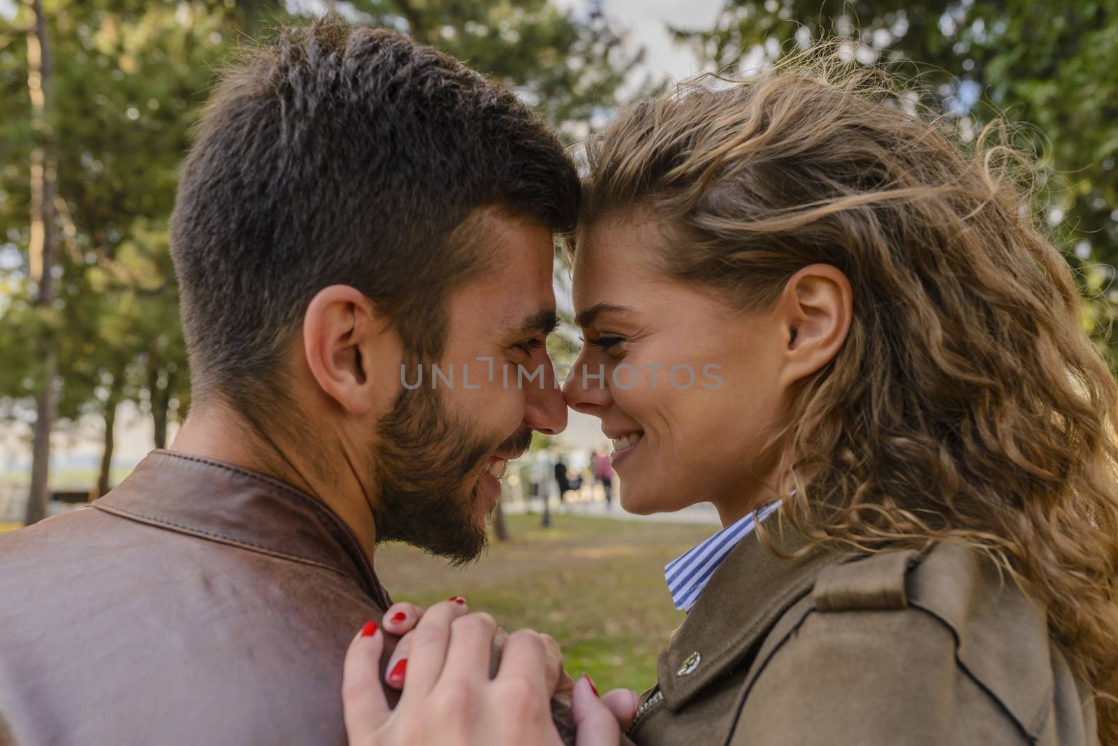 Beautiful long haired woman is in love with her handsome boyfriend