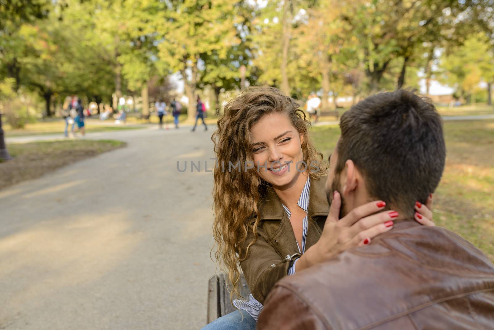 Young couple enjoying the time in the city park by VeraAgency