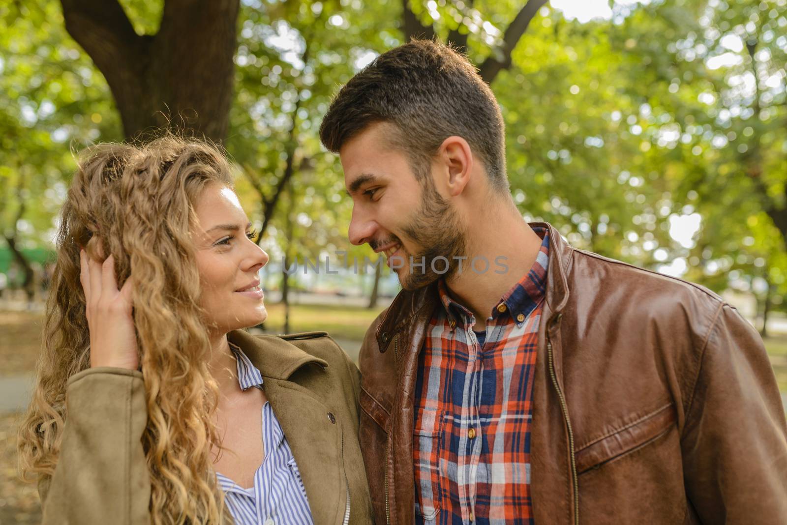 Attractive long hair woman and her handsome boyfriend are having emotional moments