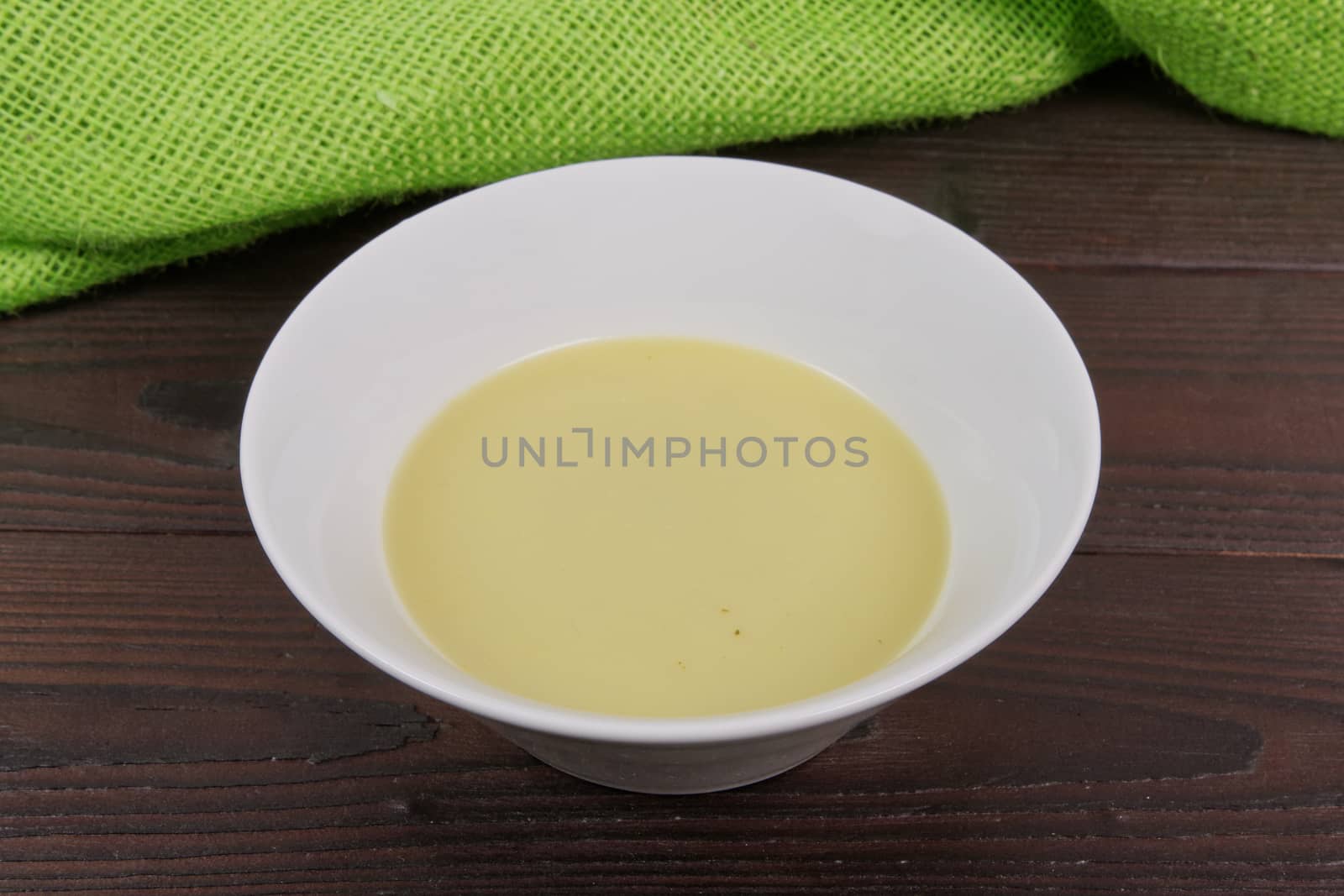 Healthy spinach soup on a wooden table