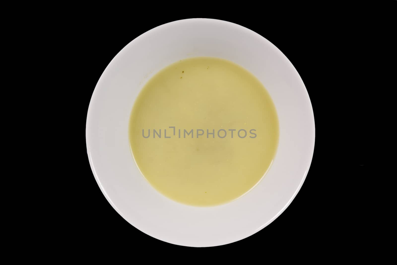Healthy spinach soup on a black background