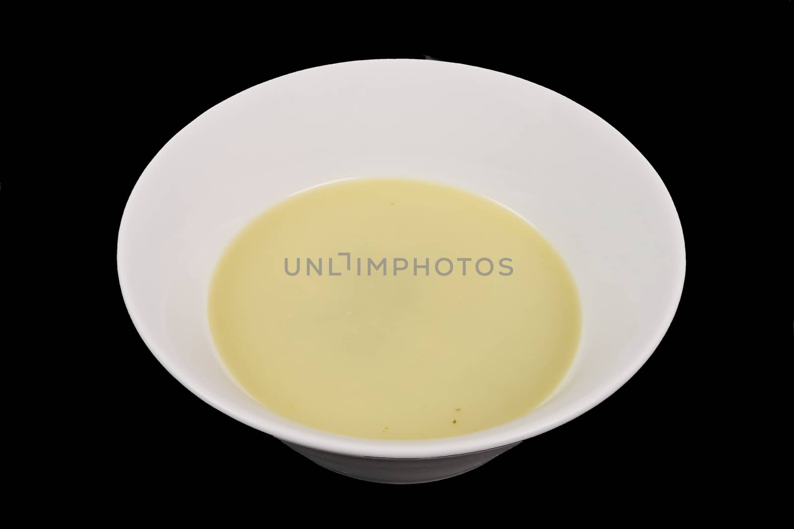 Healthy spinach soup on a black background