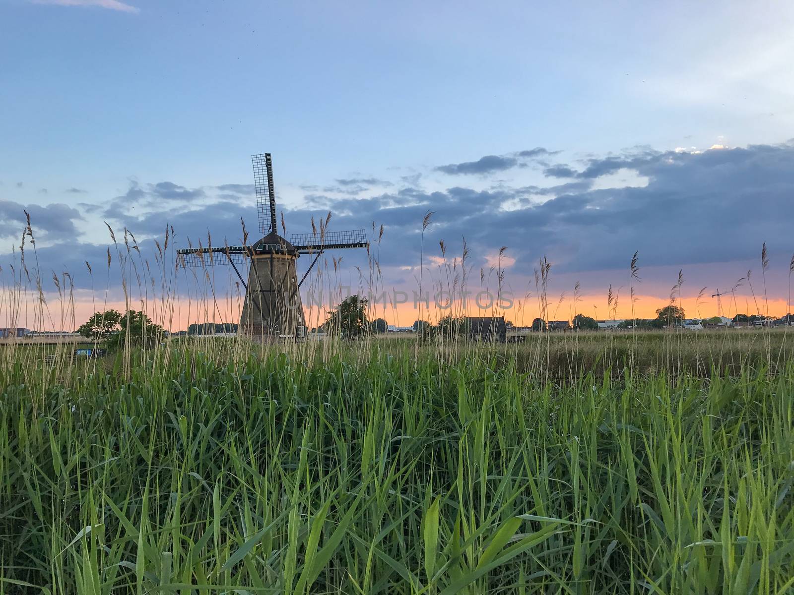 Beautiful dutch windmill landscape at the famous Kinderdijk canals, UNESCO world heritage site