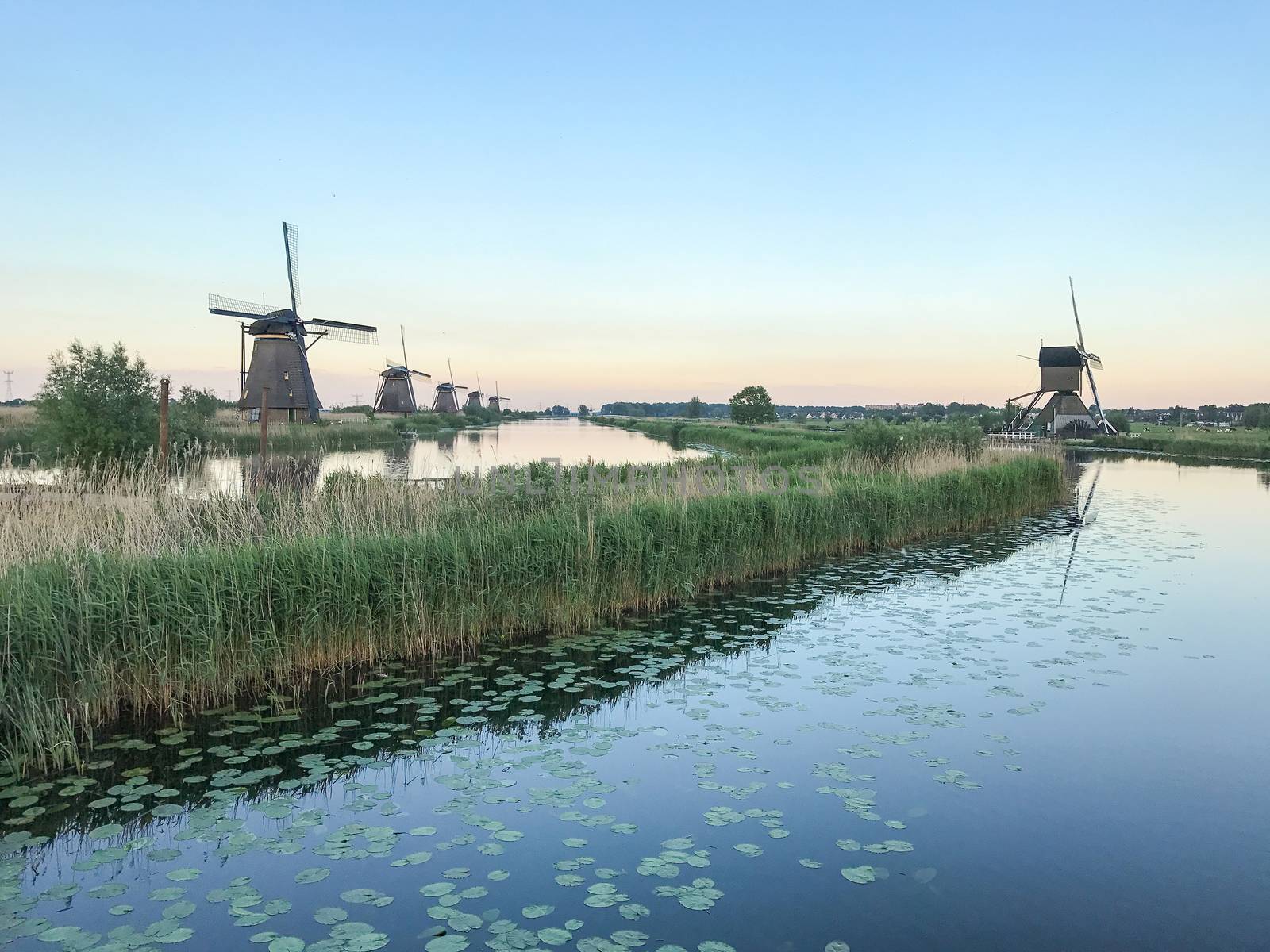 Beautiful dutch windmill landscape at the famous Kinderdijk canals, UNESCO world heritage site