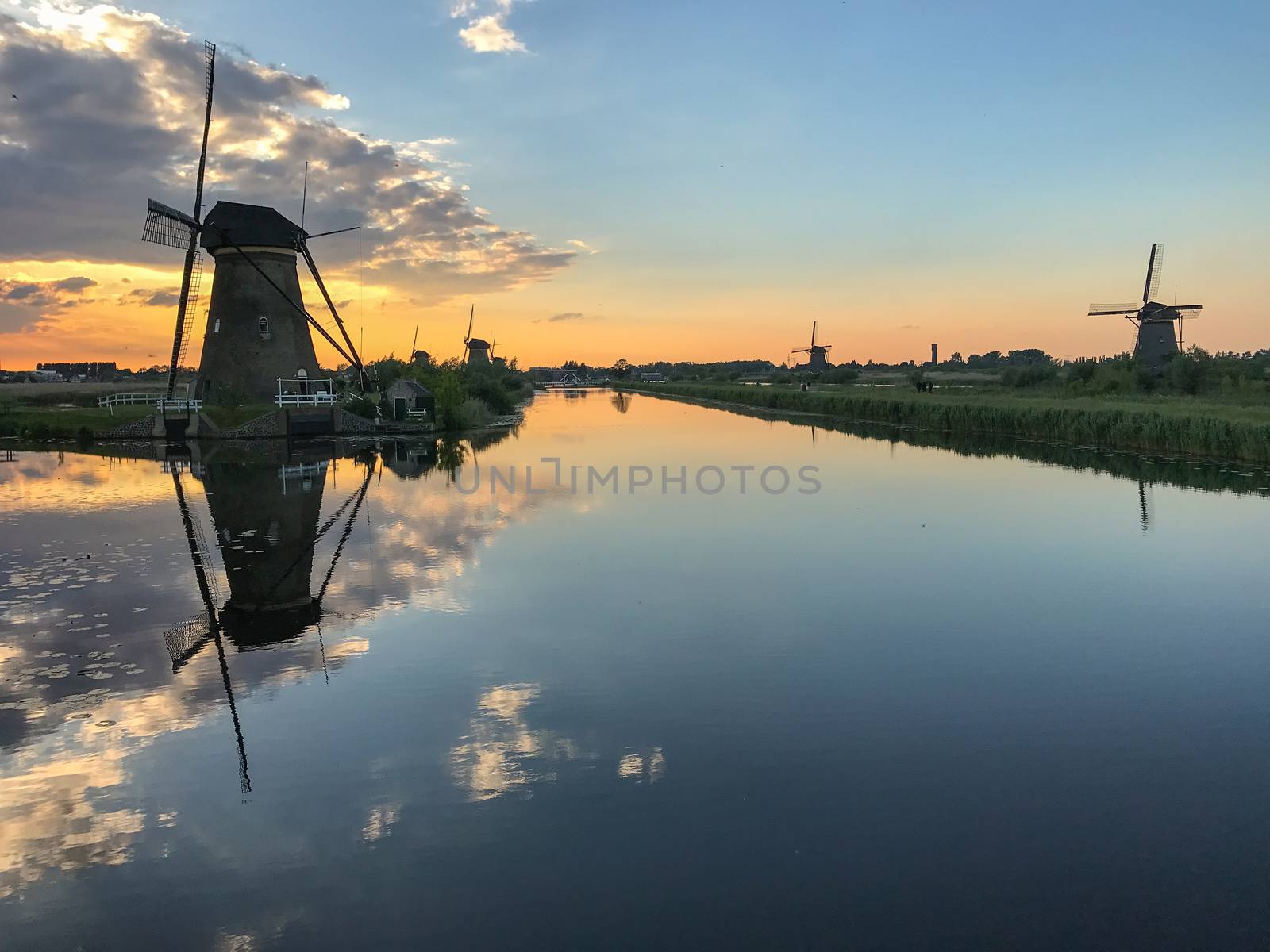 Beautiful dutch windmill landscape at the famous Kinderdijk canals, UNESCO world heritage site