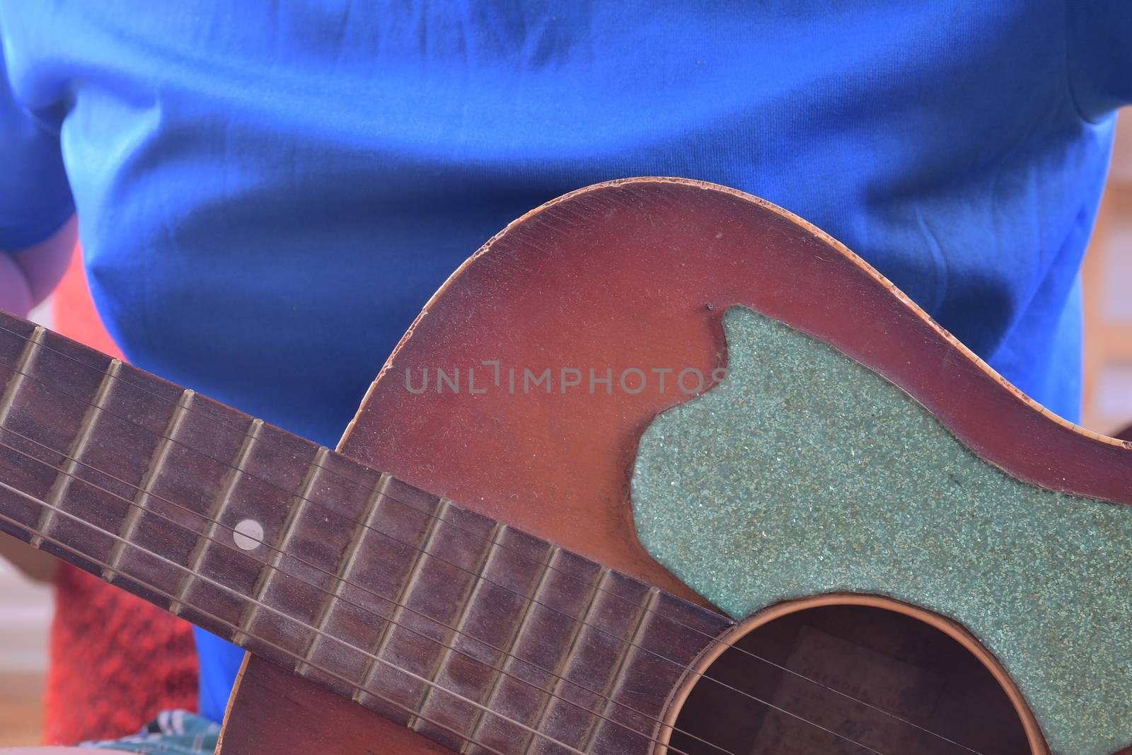 Man playing acoustic guitar. Musical concept. Close-up