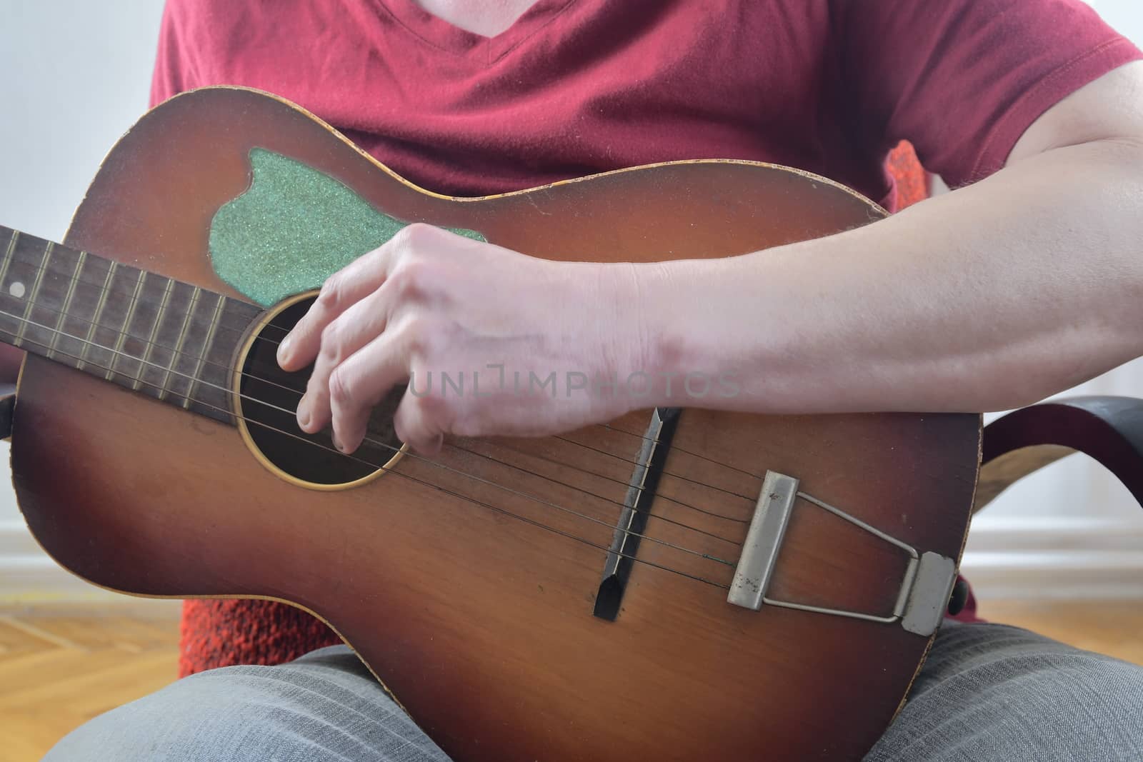 Man playing on acoustic guitar. Musical concept. Close-up