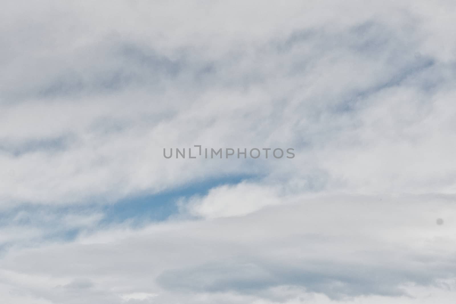 Clear blue sky with plain white cloud with space for text background