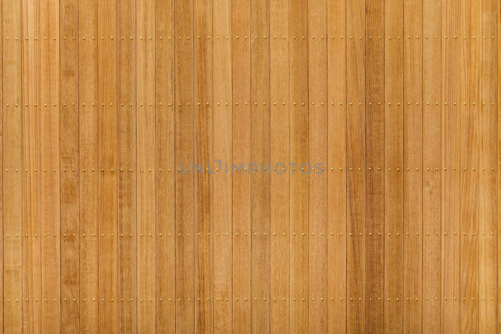 Close up teak wood panel floor wall with brass nail