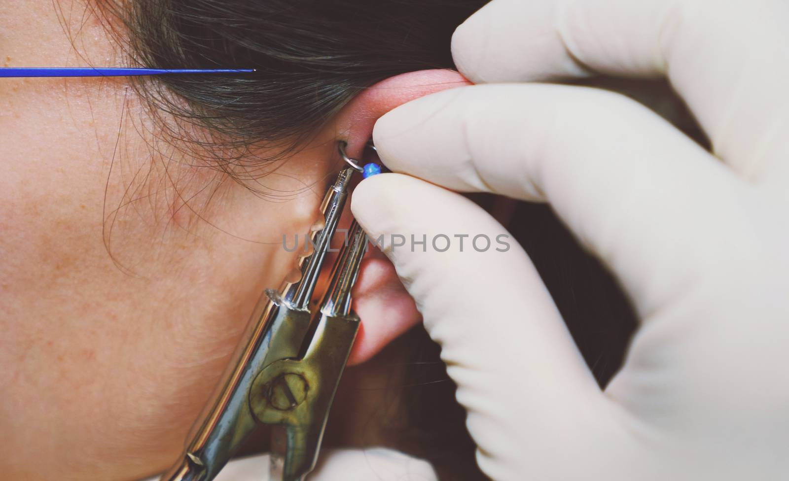 Close up on equipment for ear piercing by HD_premium_shots