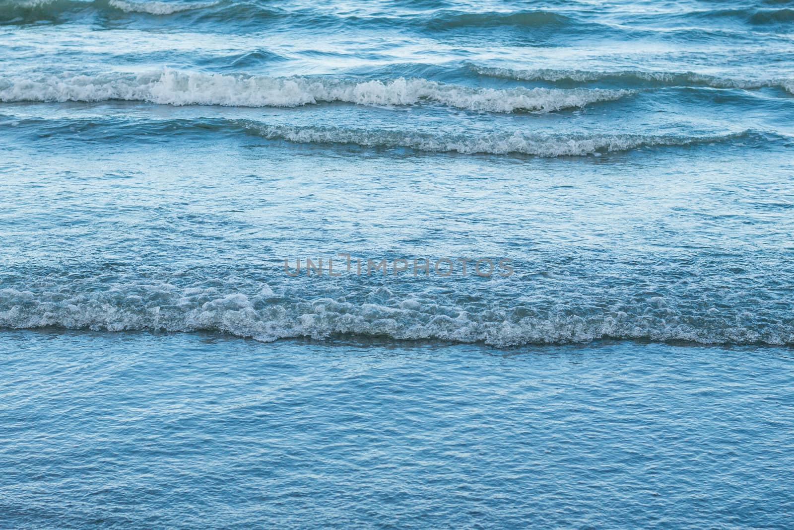 Sea waves beach sand background.
