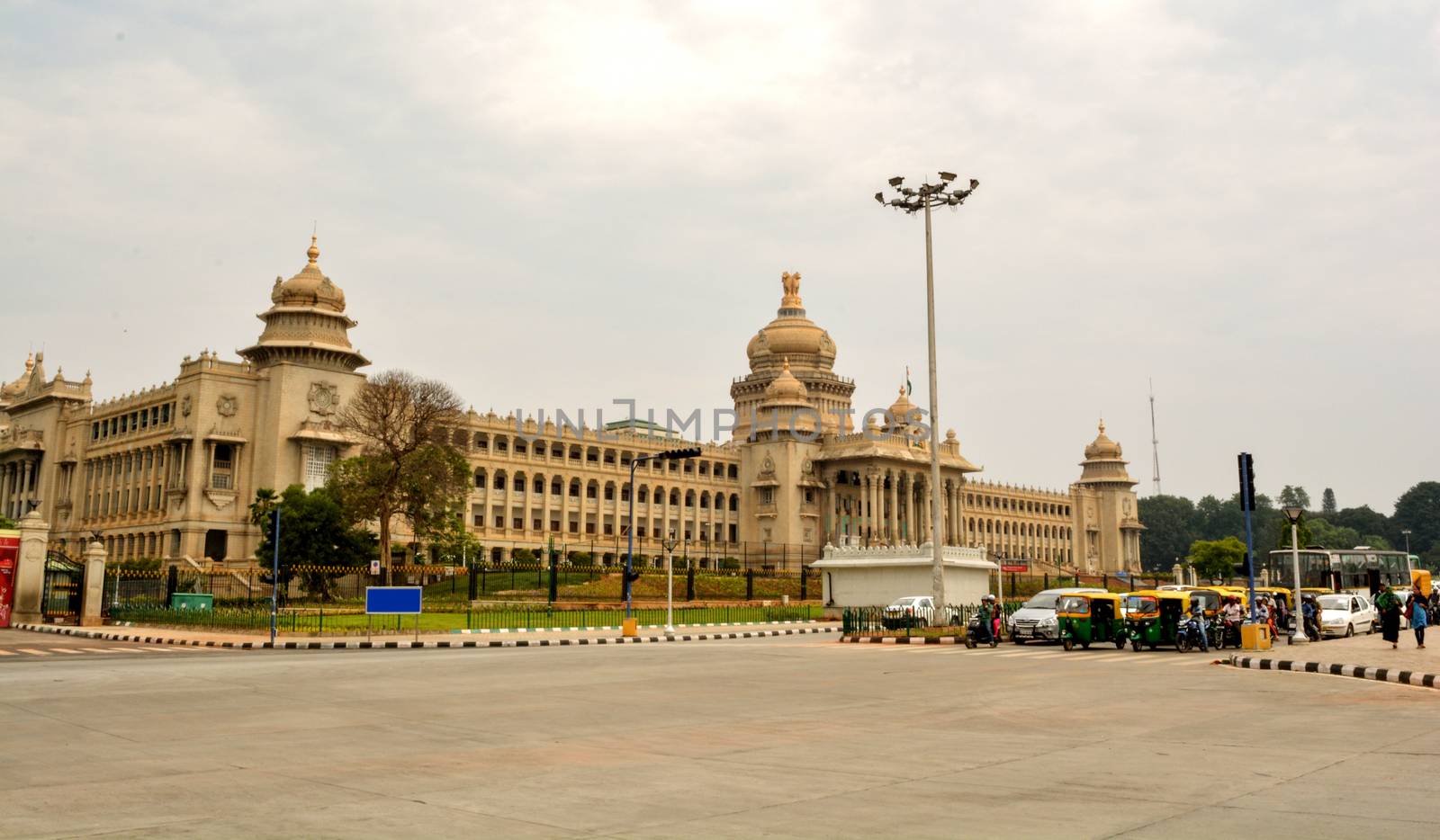 vehicles wating of traffic signl in front of Vidhana Soudha the state legislature building in Bangalore, India by lakshmiprasad.maski@gmai.com