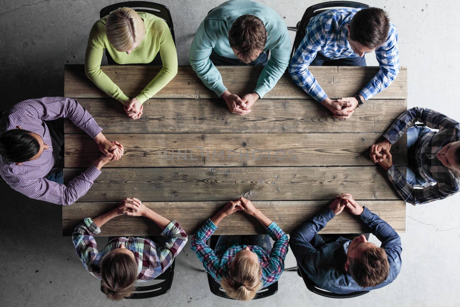 Modern business meeting concept, people in casual clothes sitting around wooden table