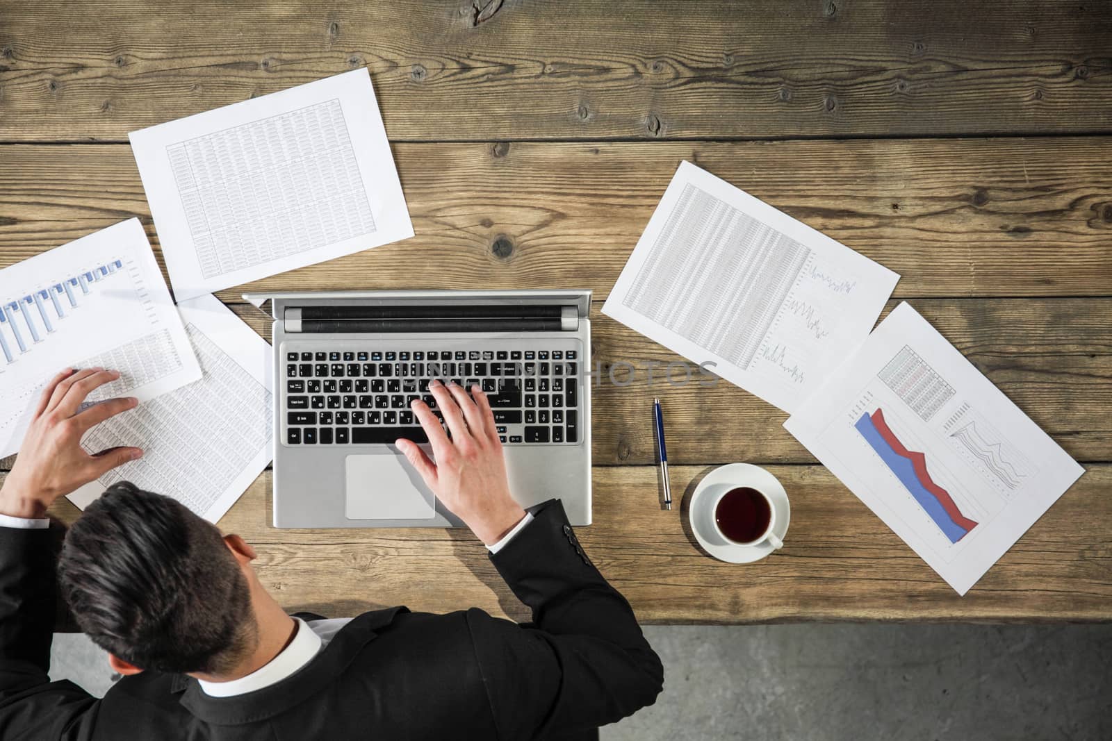 Business man working with laptop and statistics data