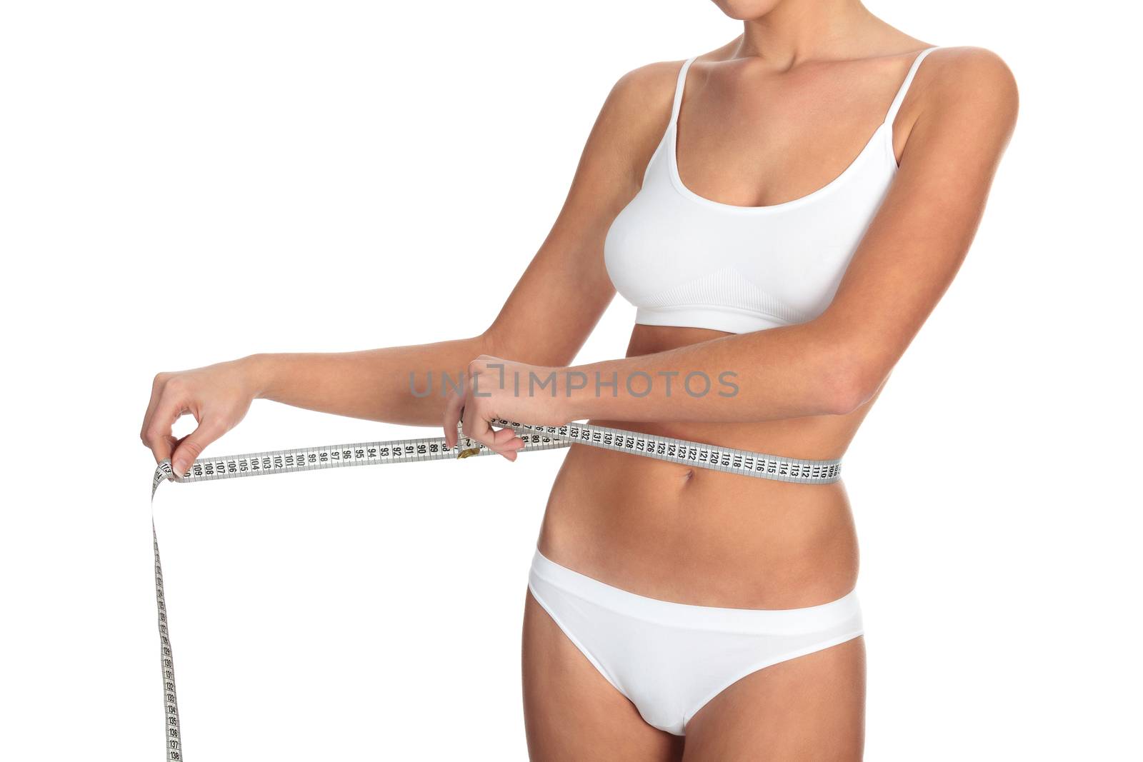 Slim woman measuring her waistline, isolated on white background by Nobilior