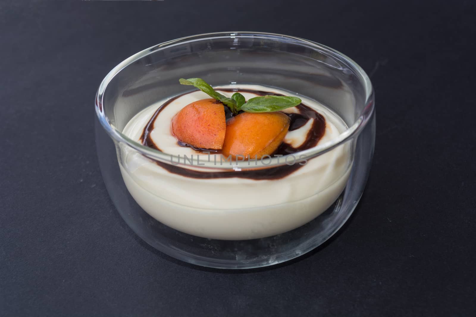 Dessert in glass bowl filled with a fruity pudding.