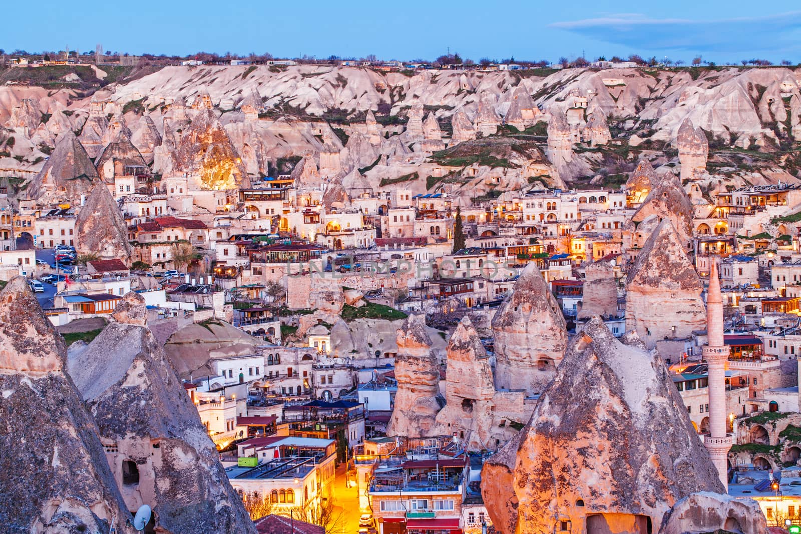 Cylindrical stone cliffs and cave houses in Goreme, Cappadocia, Turkey