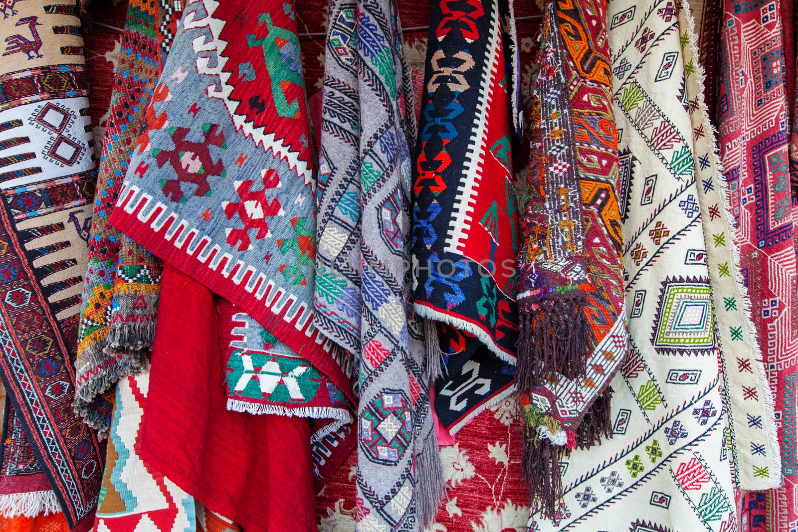 Assortment of ancient homemade turkish oriental carpets in in Goreme street market, Cappadocia, Turkey