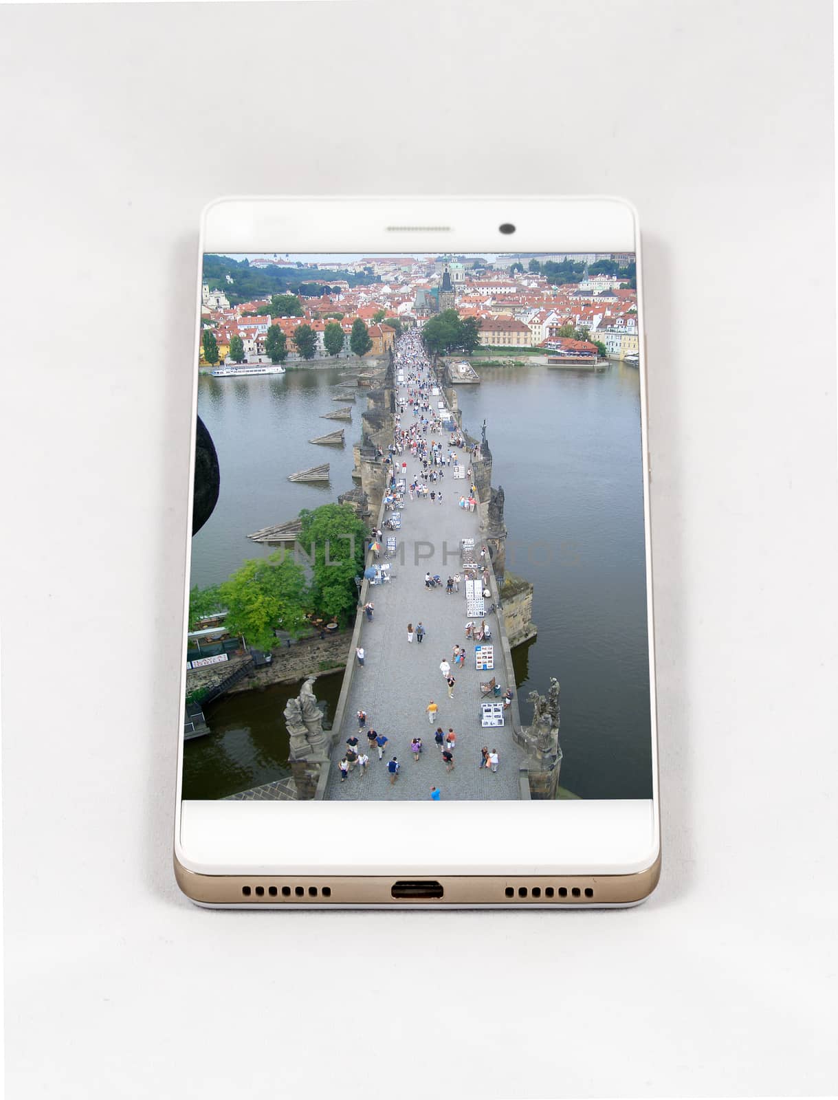Modern smartphone with full screen picture of Charles Bridge and the Castle of Prague, Czech Republic. Concept for travel smartphone photography. All images in this composition are made by me and separately available on my portfolio