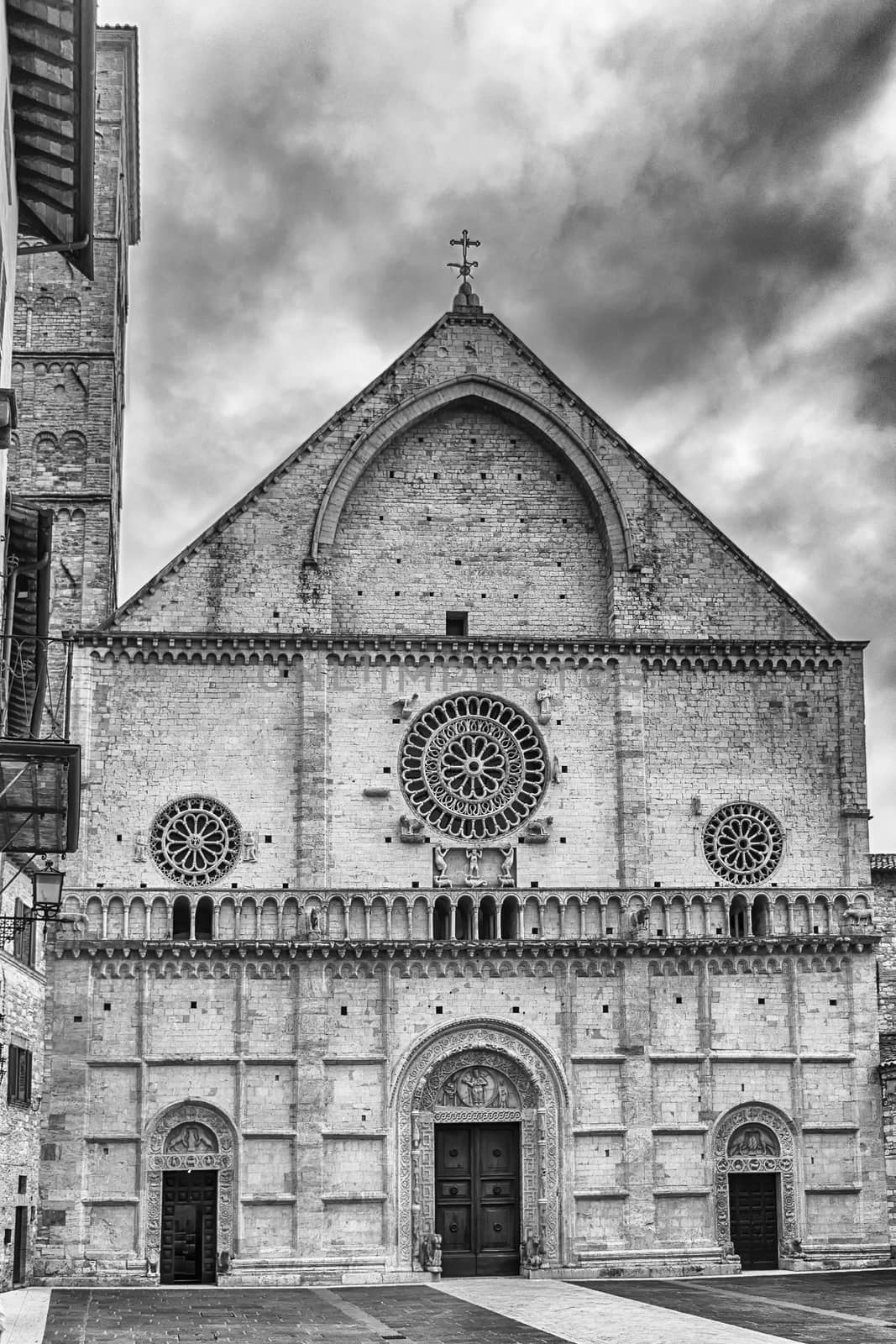 Exterior view of the medieval Cathedral of Assisi, Italy by marcorubino