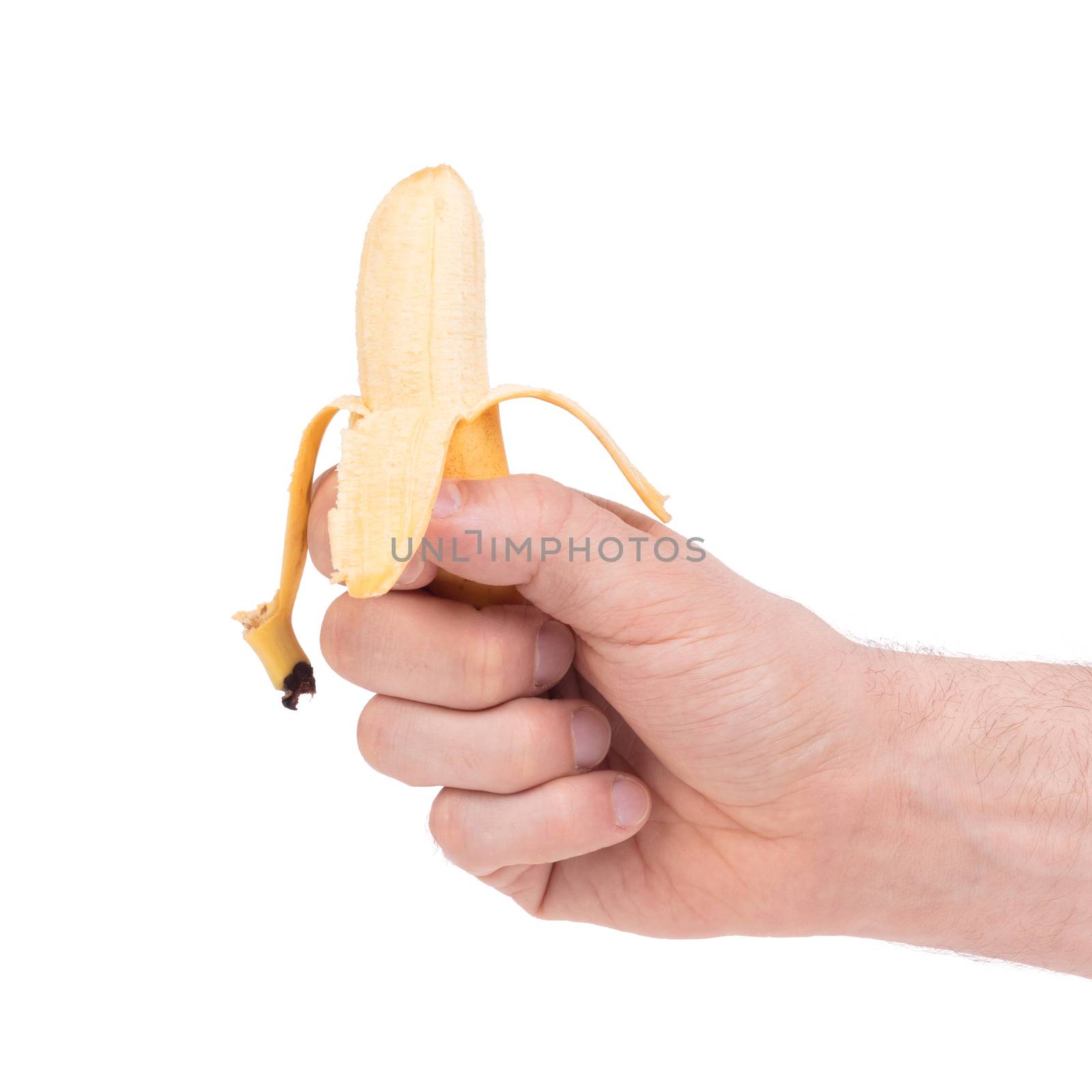 Small tropical banana in a hand, isolated on white