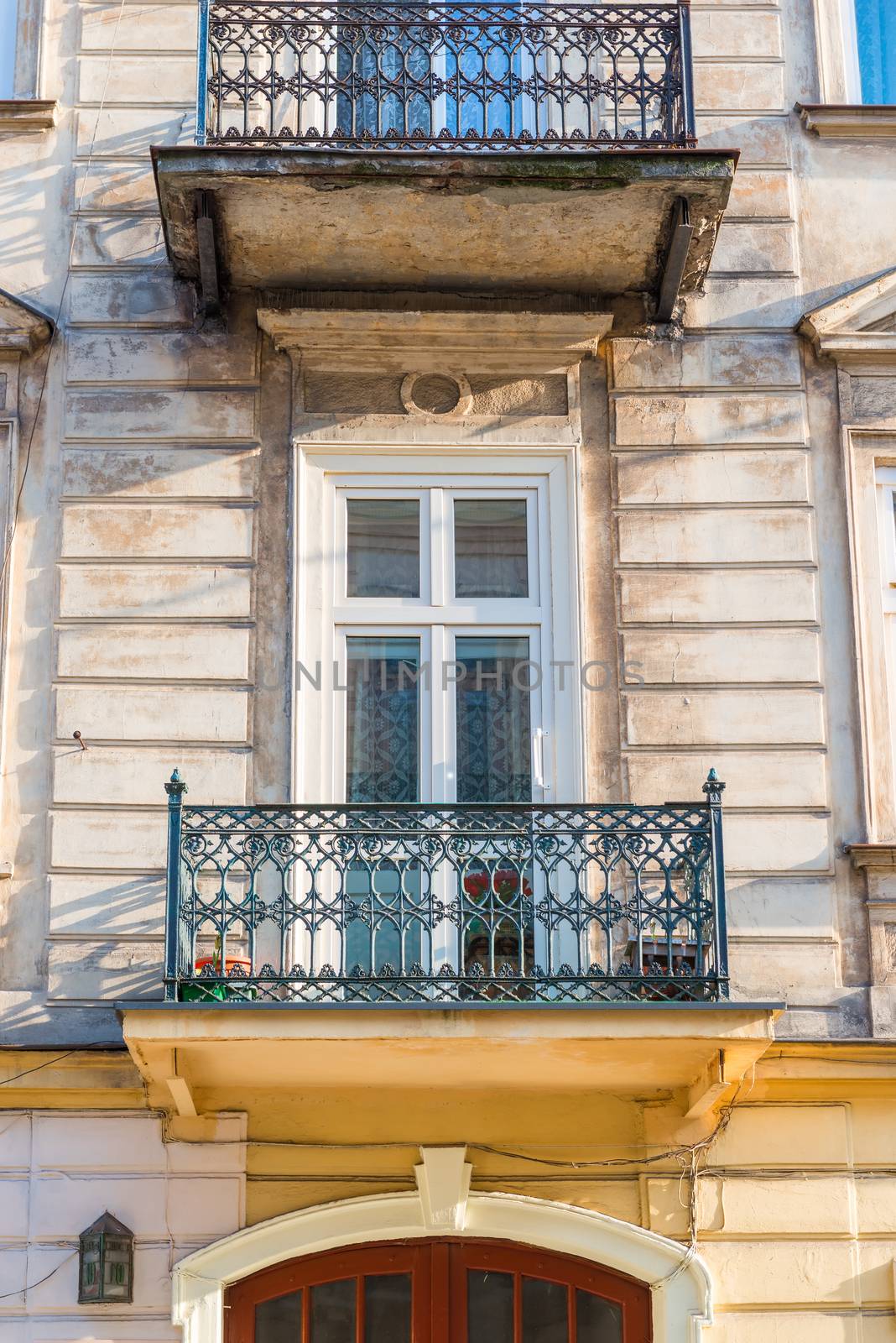 close-up balcony of a building with an openwork metal fence