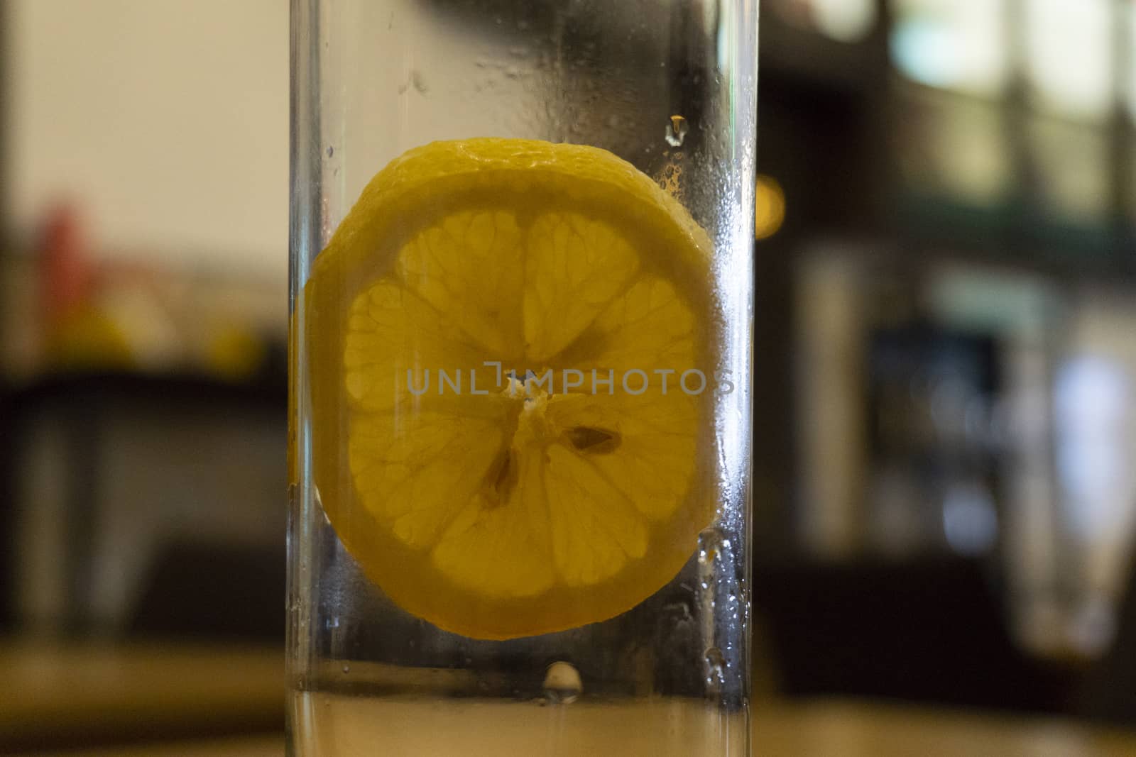 lemon wedge in refrigerant drink glass of lemon in slice