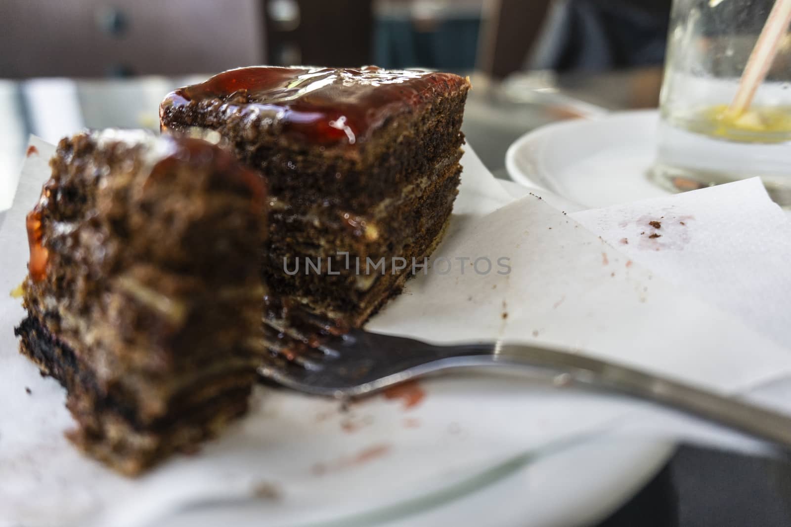 Chocolate cake with strawberries sliced strawberries and topping