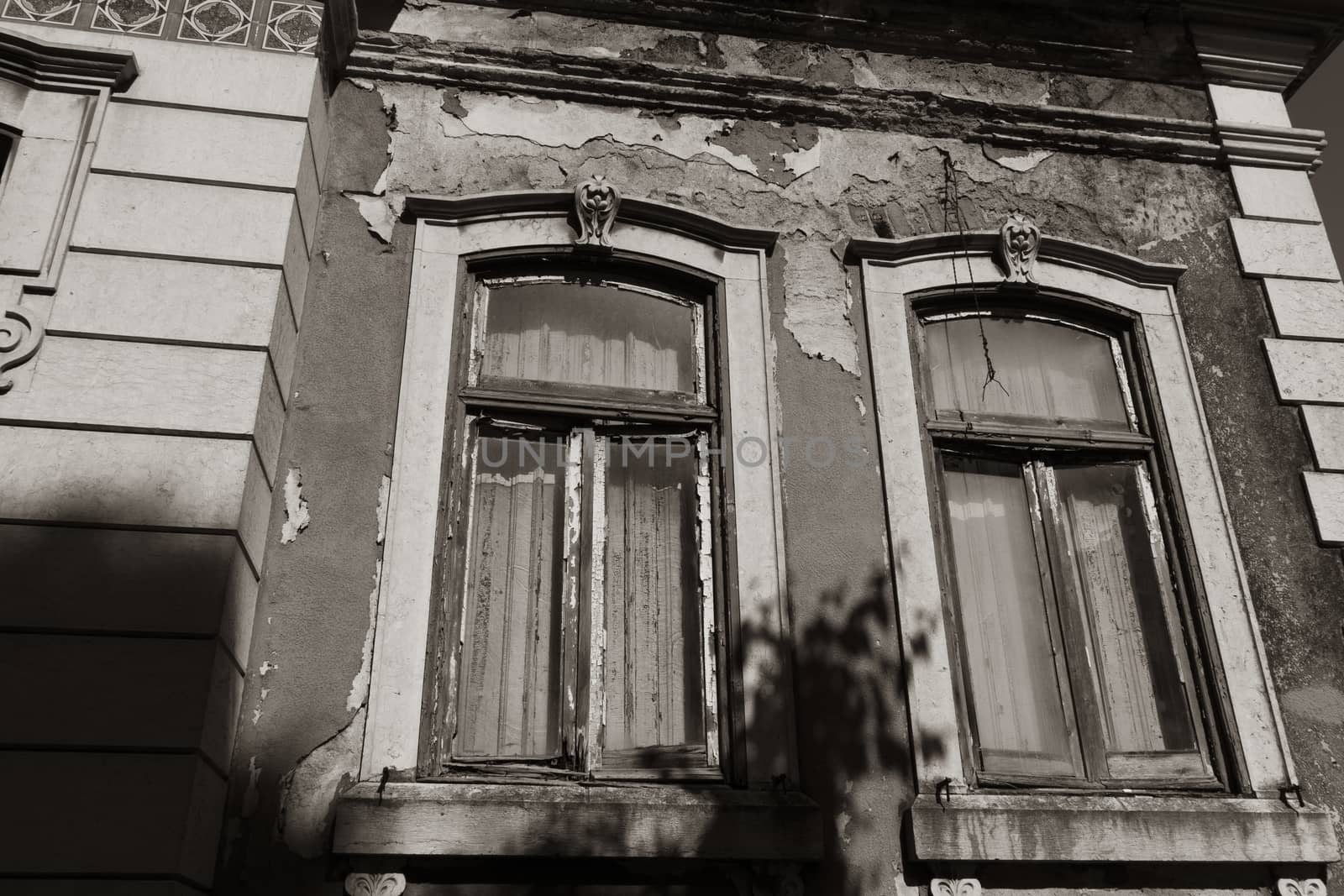 Ruined ancient windows in black and white photo