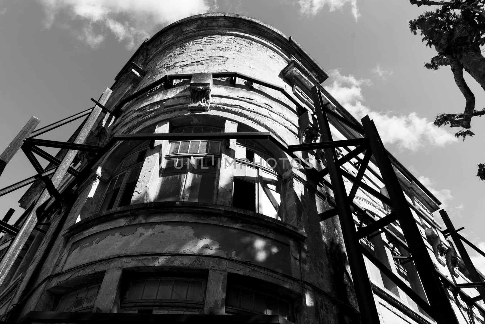 ancient ruined building with iron scaffolding by lovecomunication