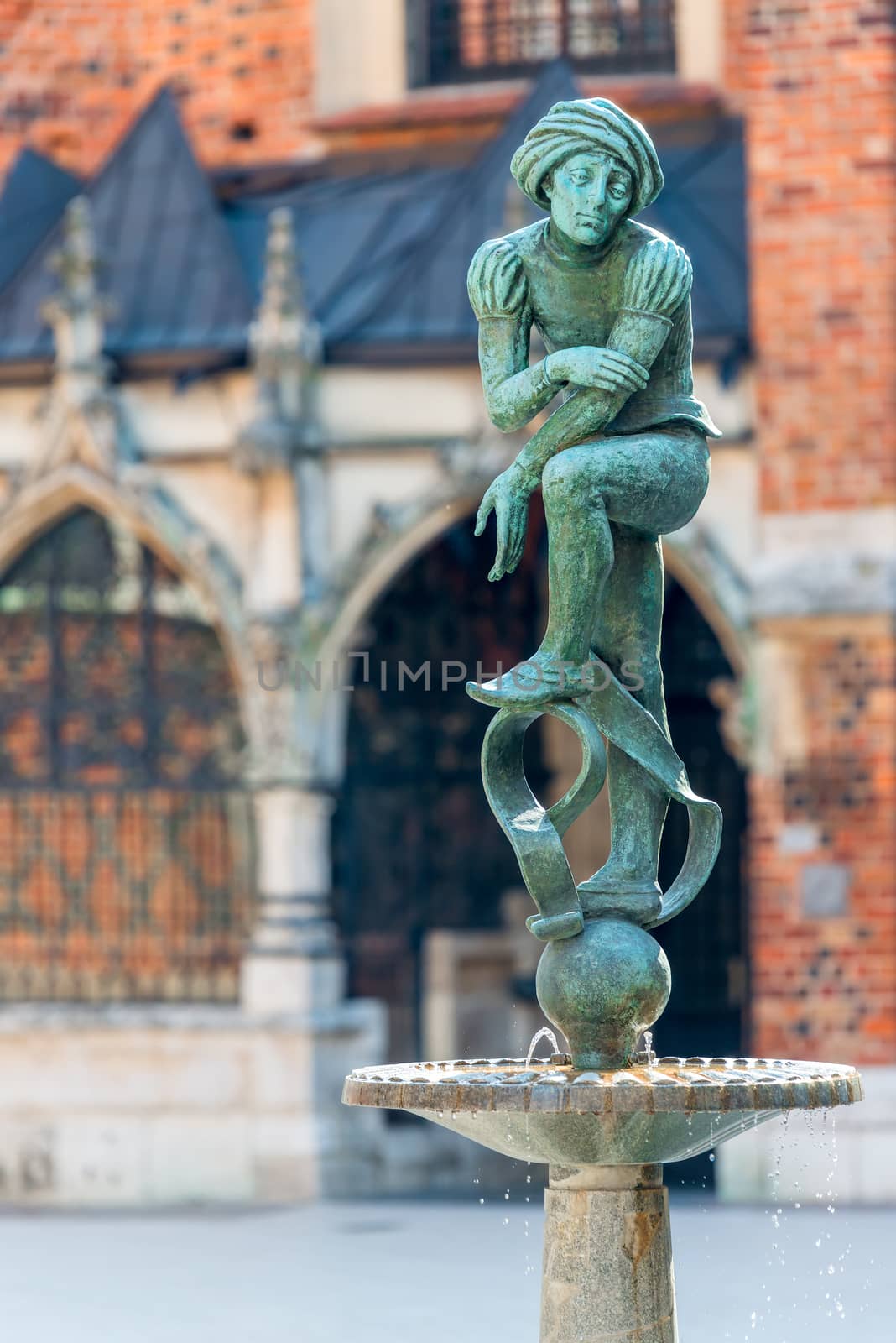 Sculpture Jacques poor student fountain in the center of Krakow, Poland