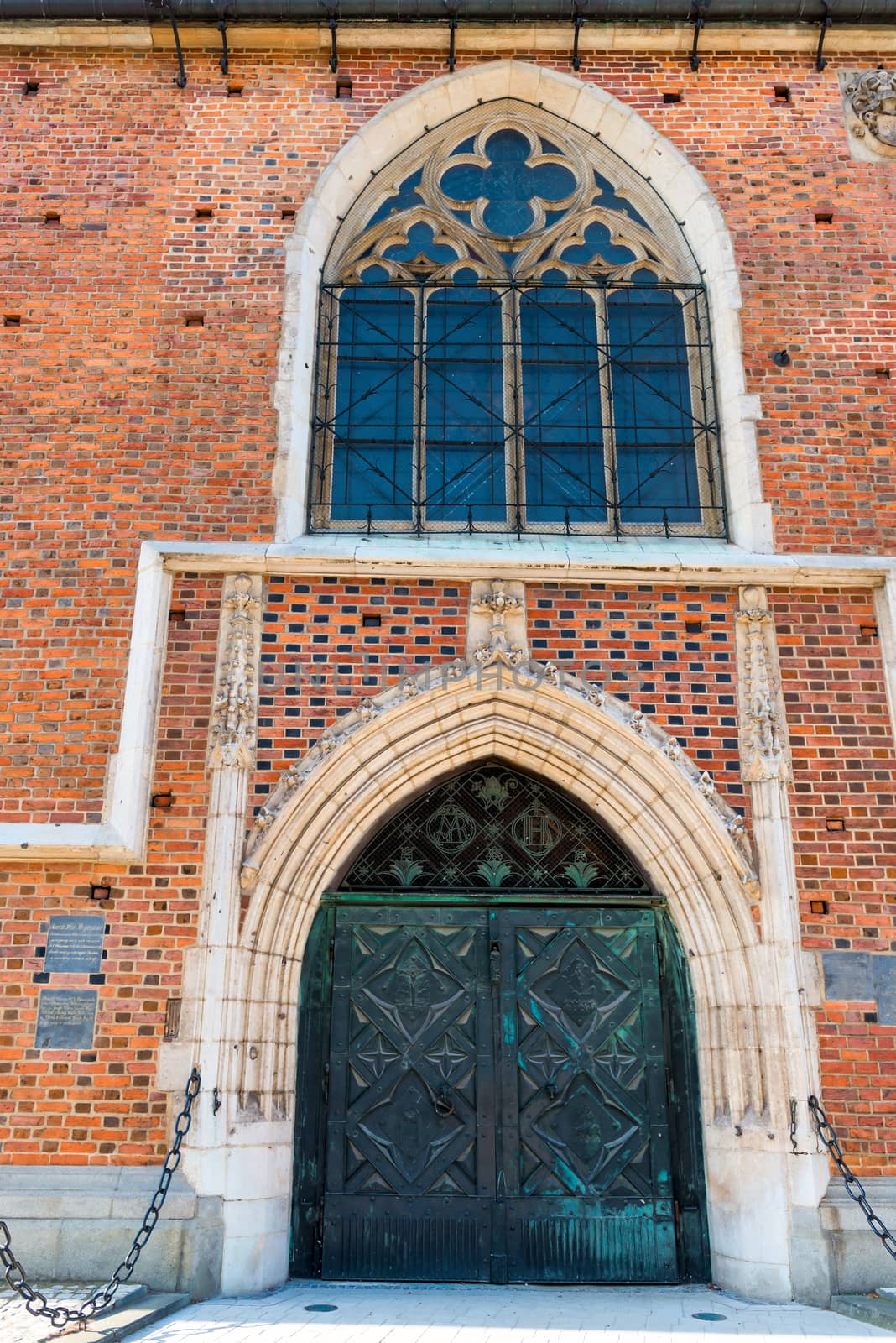 entrance to the brick catholic church massive metal gates