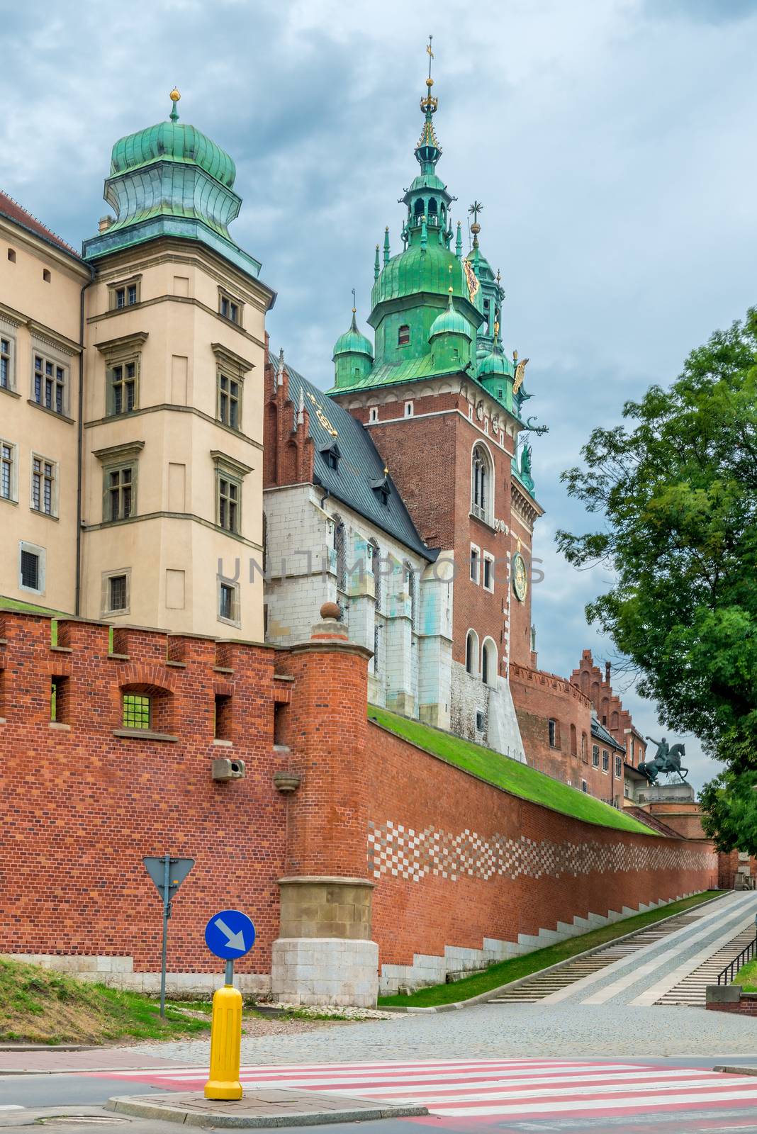 Krakow, Poland - August 13, 2017: Krakow, high brick tower - Wawel Castle on blue sky background