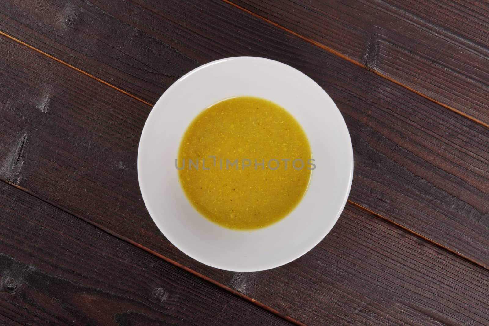 Creamy broccoli soup on a wooden table