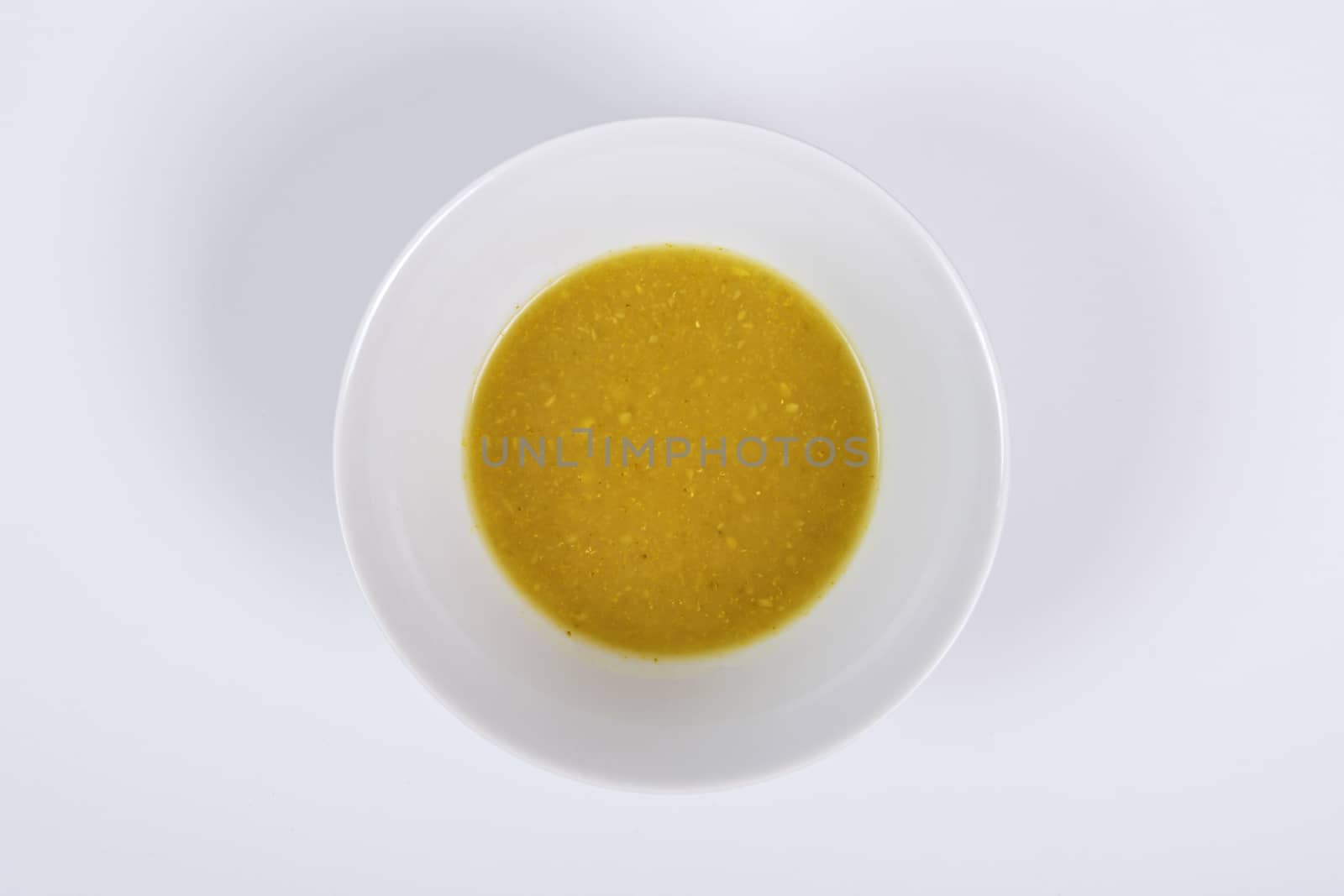 Creamy broccoli soup on a white background