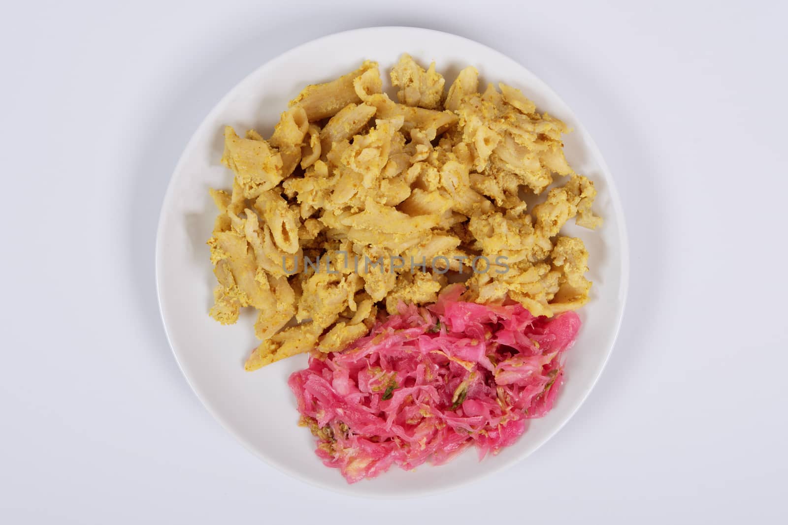 Whole-grain pasta with tofu on a white background
