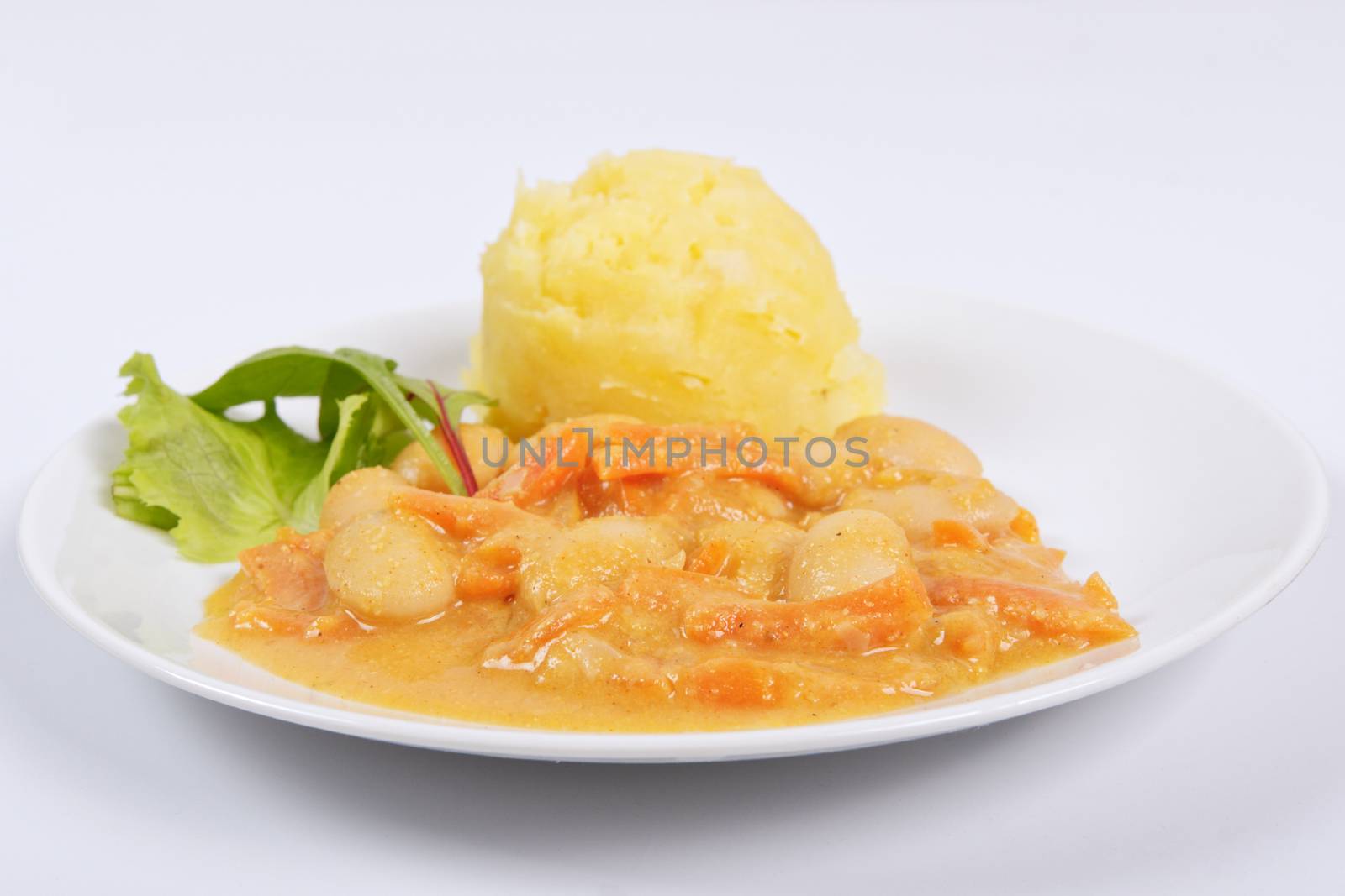 Beans with carrots and potatoes on a white background