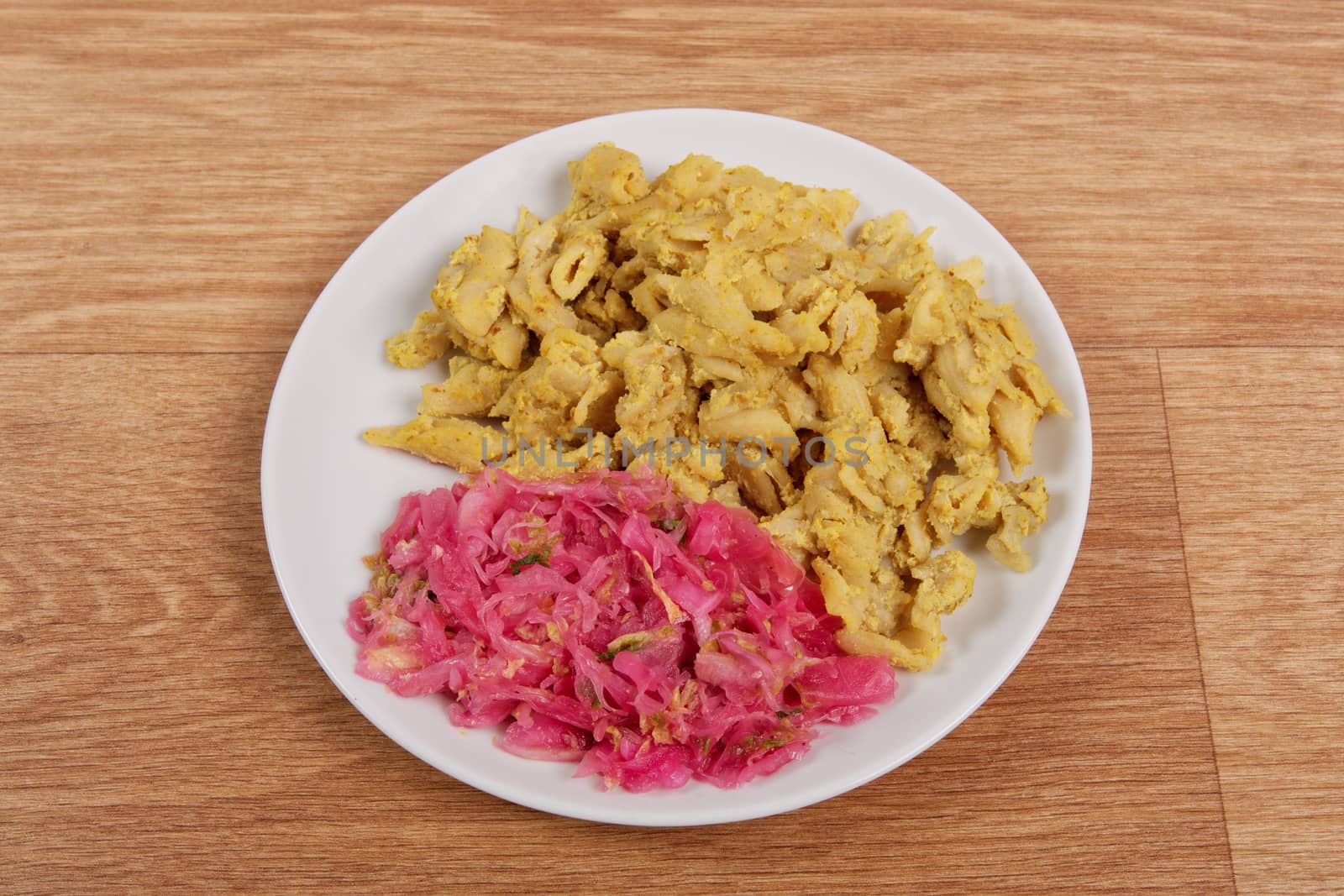 Whole-grain pasta with tofu on a table by neryx