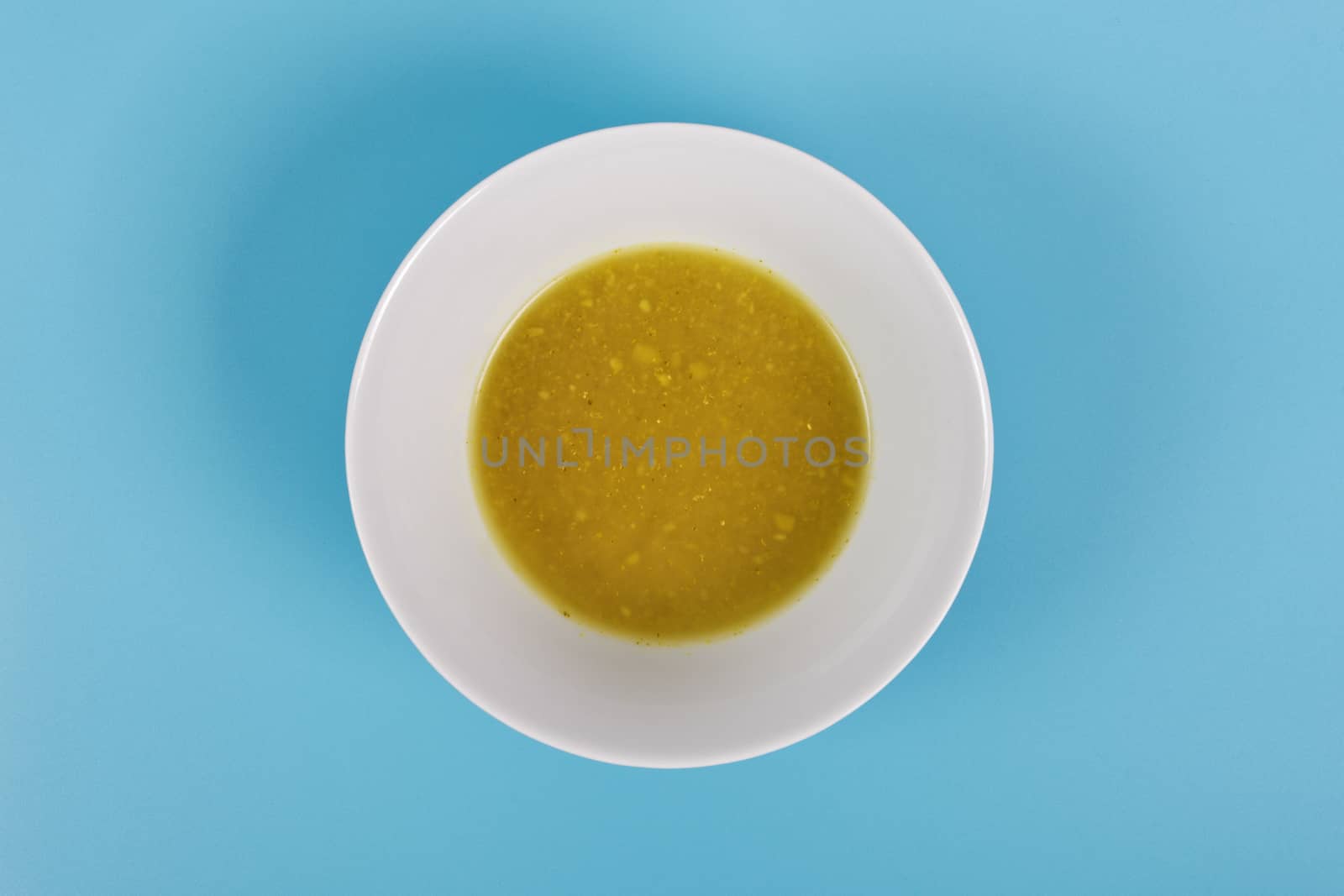 Creamy broccoli soup on a blue background