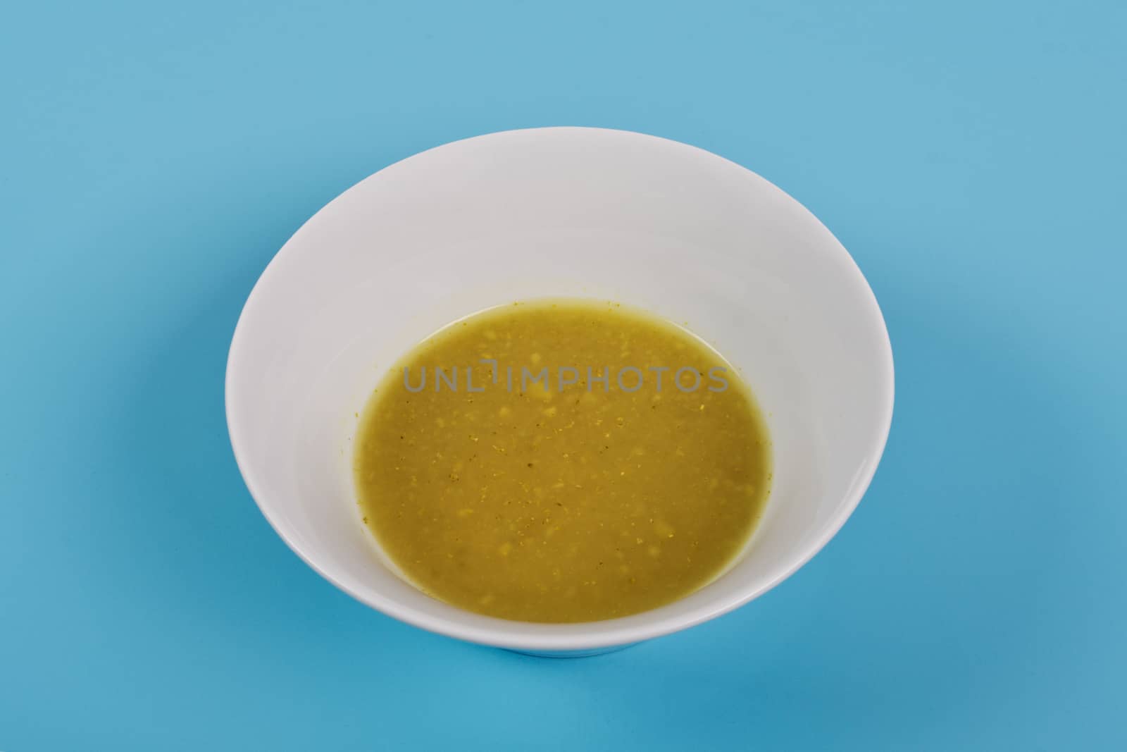 Creamy broccoli soup on a blue background