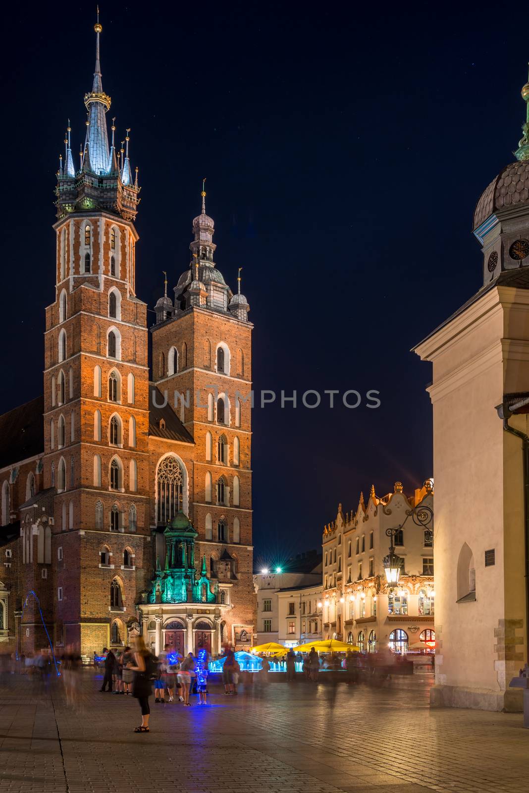 vertical night view of the Church of St. Mary in Krakow, Poland by kosmsos111