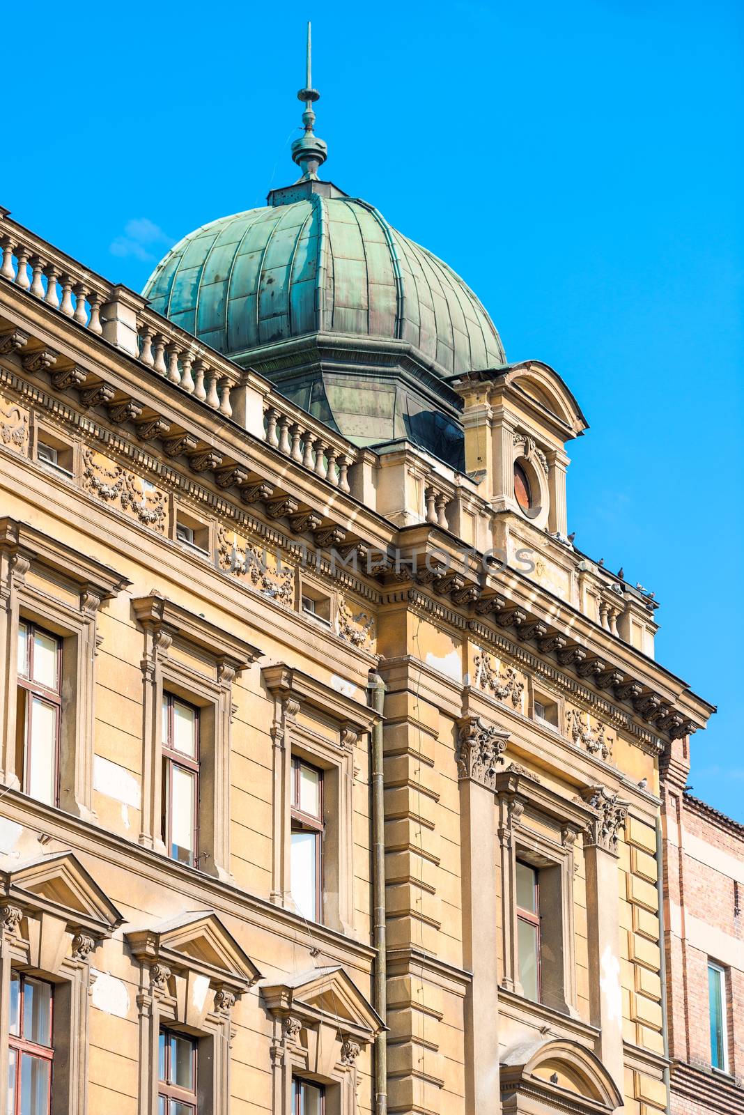 beautiful facade of a beige building in europe by kosmsos111