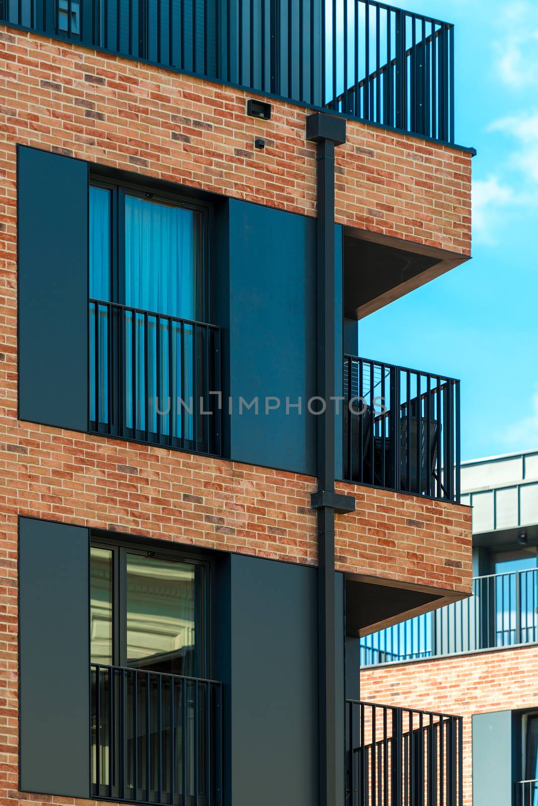 elements of a modern brick building - balconies and windows by kosmsos111