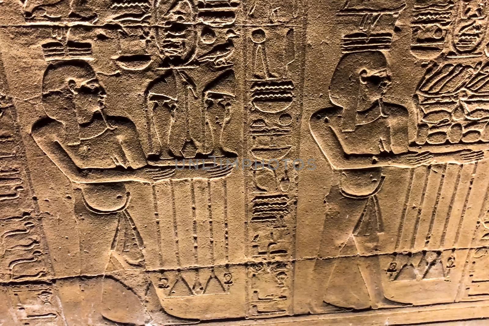 Egyptian hieroglyphs and drawings on the walls and columns. Egyptian language, The life of ancient gods and people in hieroglyphics and drawings