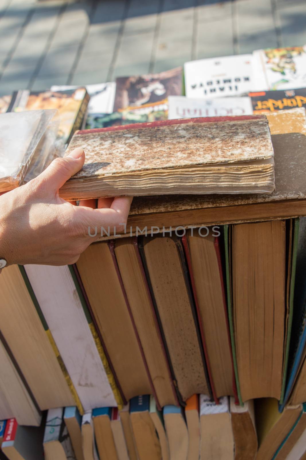 Book pages partly in view on white background