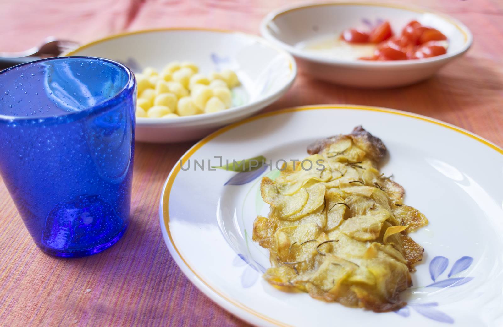 gilthead fillet in potato crust on a set table