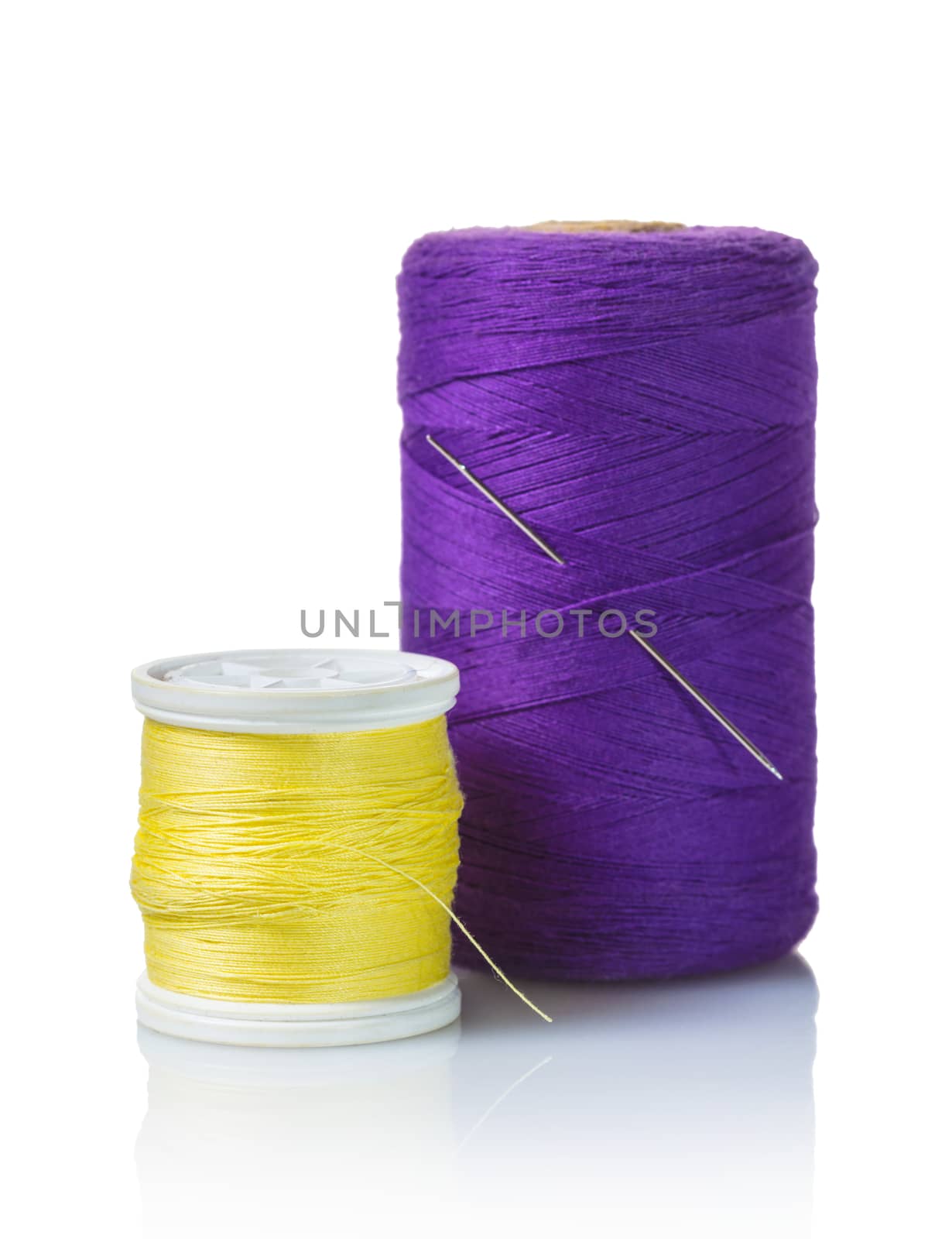 coils with colorful thread on white isolated background