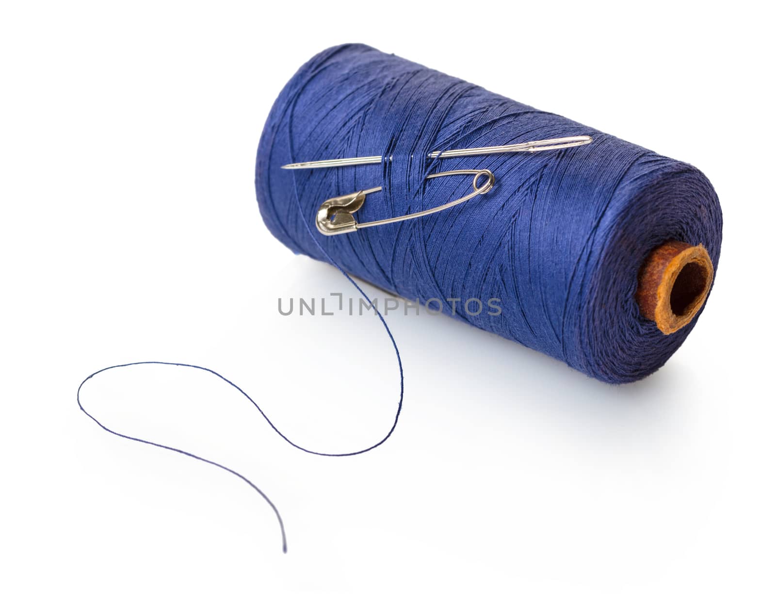 reel of blue thread on white isolated background